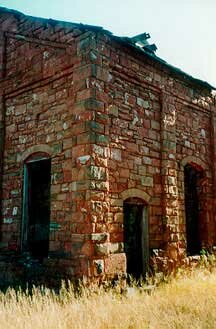 Photo of gas plant as red sandstone ruins
